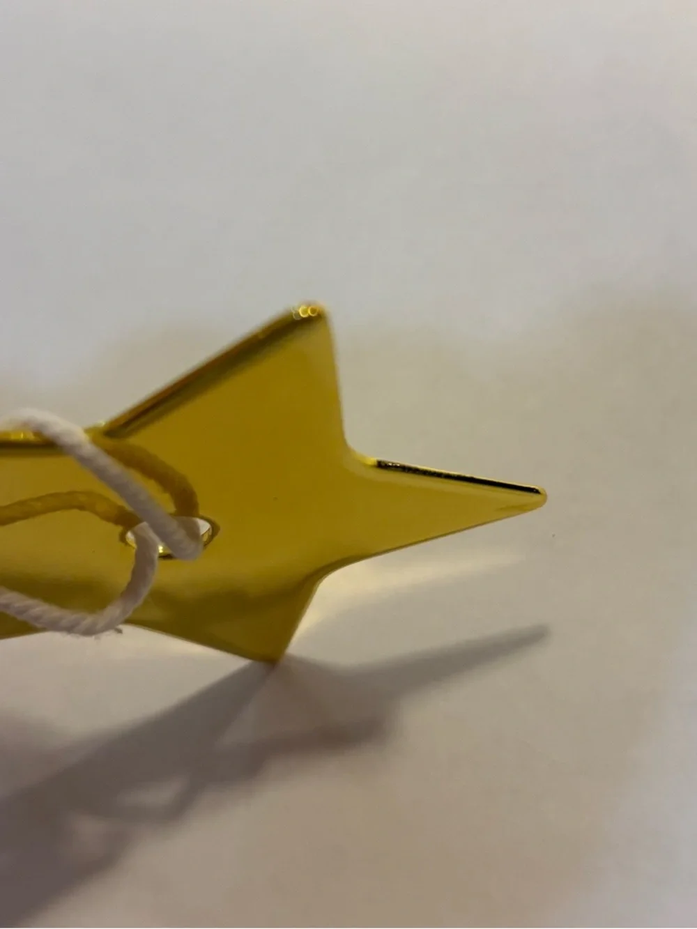 Dior Metallic Gold Star Tag with White Cord